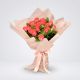 Bouquet de 24 rosas salmón envuelto en papel coreano – Flores Barranquilla